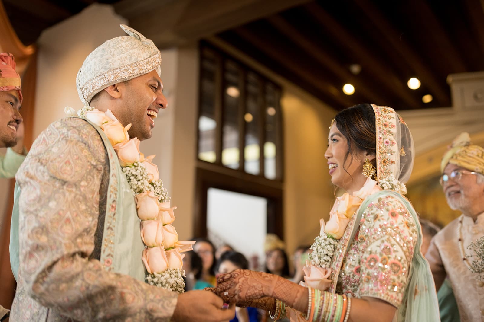 Couple exchanging garlands during wedding ceremony