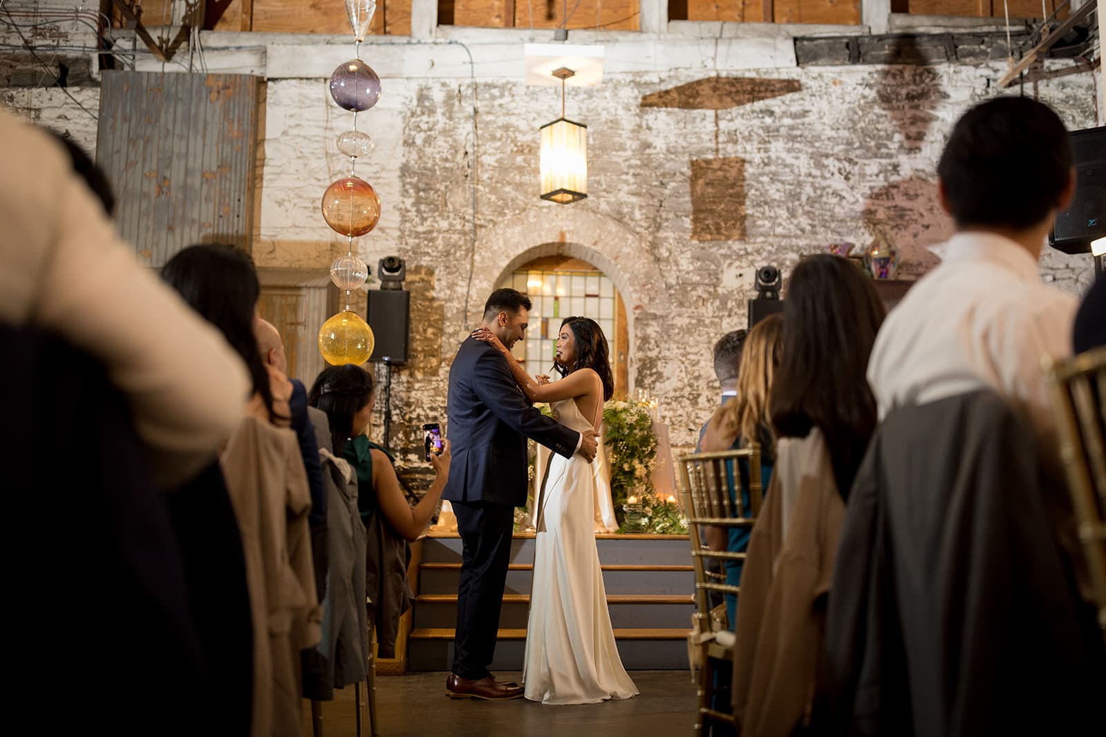 Couple first dance at rustic wedding venue
