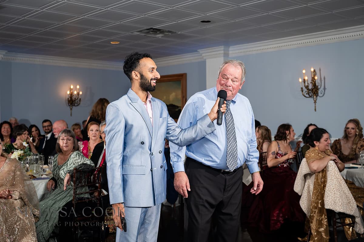 MC engaging with guest at wedding reception