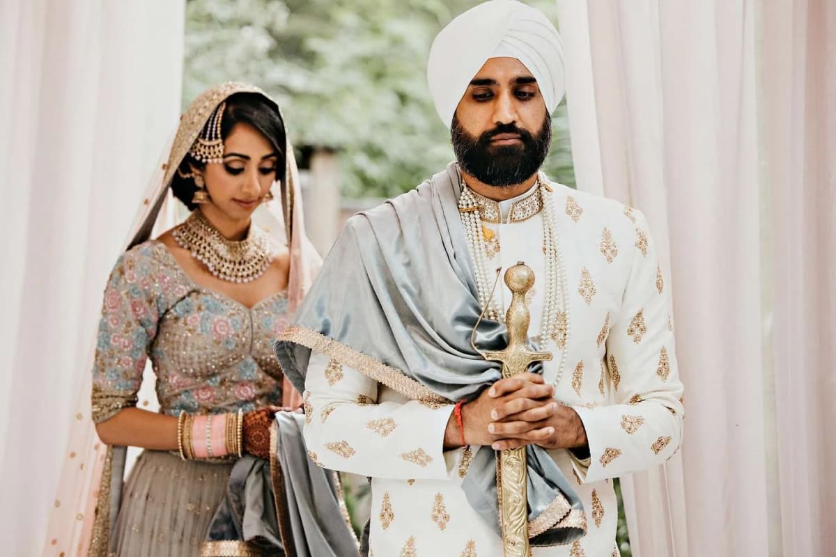 Sikh couple during traditional wedding ceremony in elegant attire